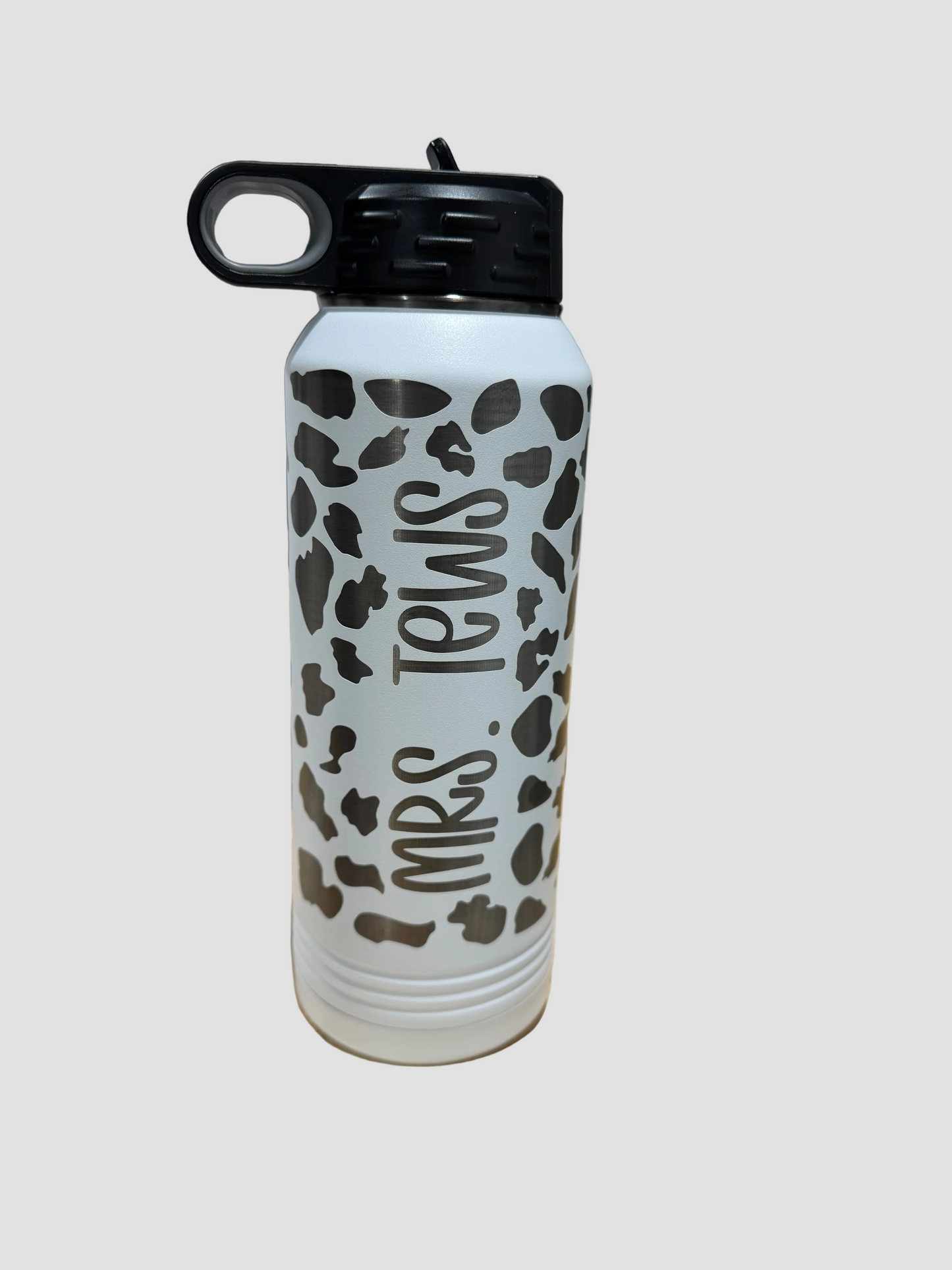 Engraved cow print water bottle additional angle showing personalization placement