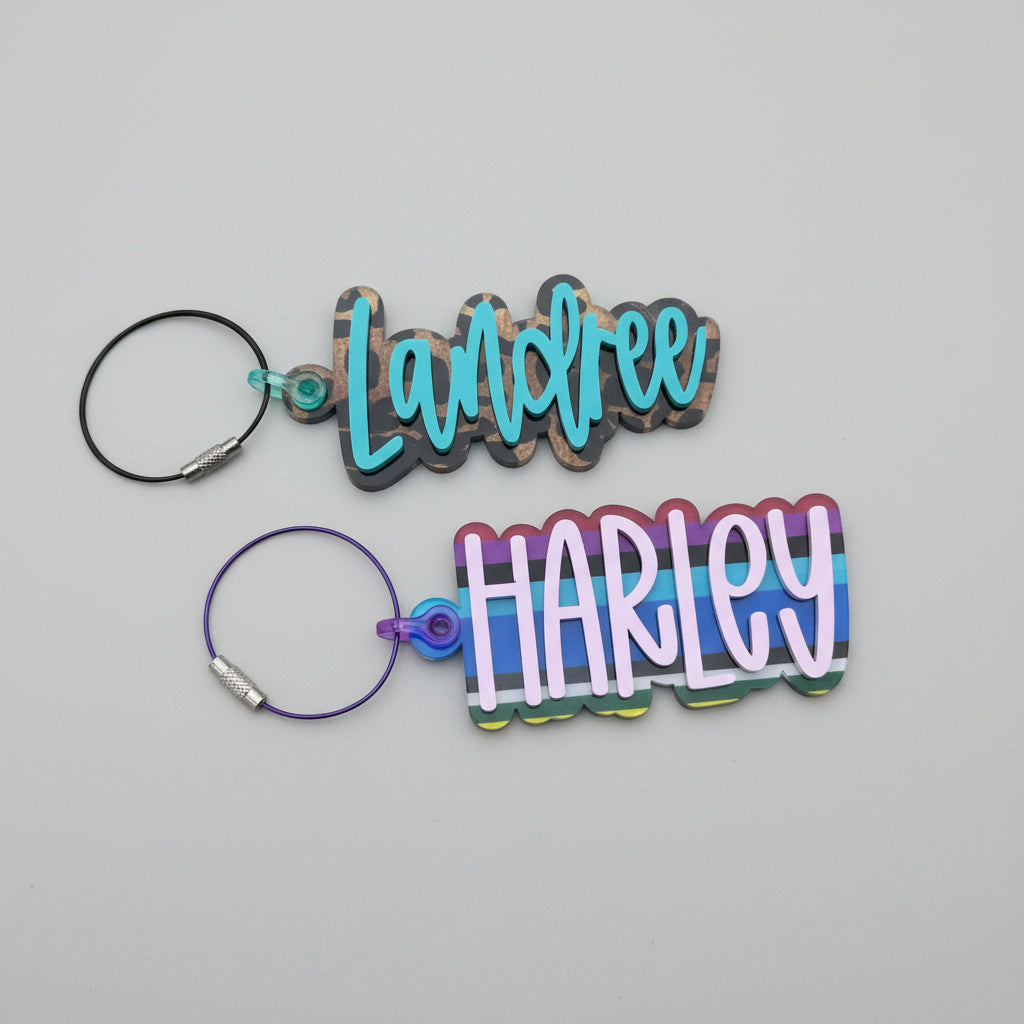 Two name tags, one with 'Landree' and the other with 'Harley', on a stone surface.